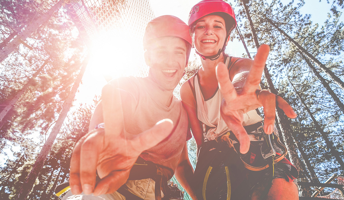 two hikers giving peace sign