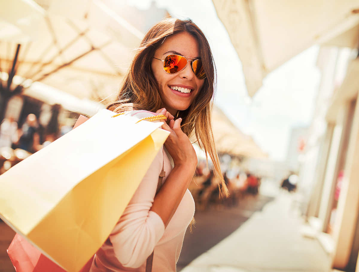 women with shopping bag outdoors